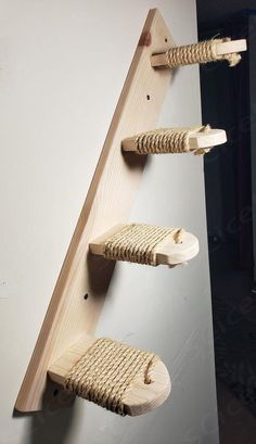 three pieces of wood are attached to the wall