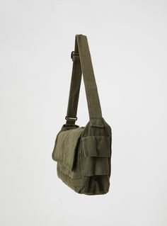 Crossbody bag, denim material  Adjustable crossbody strap, zip fastening, three separate pockets  98% cotton 2% spandex  Cold hand wash     Length: 47cm / 18.5in   Height: 25cm / 9.8in Army Bag, Cold Hands, Denim Material, Crossbody Strap, Army Green, Crossbody Bag, Hand Wash, Spandex, Bar