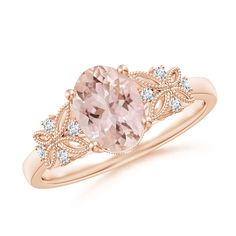 This exquisite vintage-style ring in 14k rose gold showcases a delightful oval morganite in a prong setting. It is intricately designed with butterfly motifs on the band, leaf-shaped cutwork in the gallery and fine beading details. The diamond accents on the top and the front of the shank add a brilliant touch to this ring. Oval Morganite Ring, Morganite Jewelry, Pretty Engagement Rings, Vintage Style Rings, Morganite Ring, Pear Shaped Diamond, Morganite, The Gallery, Wedding Sneaker