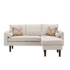 a white couch with two pillows on it