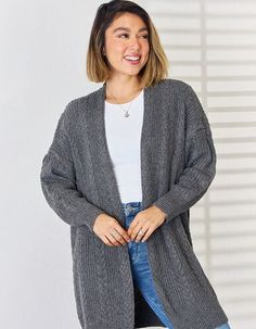 Stay on top of your style game with the Vanessa Cable-Knit Open Front Cardigan! This playful top is the perfect addition to your wardrobe, offering a quirky and fun twist on the classic cable-knit design. With its open front and cozy feel, this cardigan is sure to keep you looking stylish and feeling comfortable all day long. Features: Basic style Stretch: Moderate stretch Material composition: 100% polyester Care instructions: Machine wash cold. Tumble dry low. Imported Product measurements:S:B Trendy V-neck Cable Knit Cardigan, Spring Cable Knit Loungewear Cardigan, Spring Cable Knit Cardigan For Loungewear, Trendy Chunky Knit Cardigan For Loungewear, Open Front Cable Knit Sweater Coat For Layering, Cable Knit Open Front Sweater Coat For Layering, Trendy Cable Knit Sweater Coat For Cold Weather, Cable Knit Open Front Sweater, Cozy Cable Knit Cardigan For Loungewear