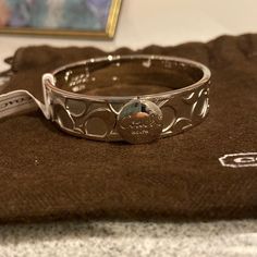 Brand New Silver Coach Bangle. Silver All Around. Button Closure Infinite Jewelry, Baddie Jewelry, Coach Bangle, Bangle Silver, Coach Jewelry, Rose Gold Bangle, Rhinestone Bow, Toggle Bracelet, Funky Jewelry