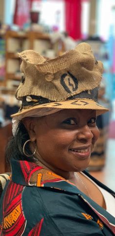 This is truly the the art of fashion hats This Zulu style hat can be worn Year round . This hat has 6 different looks. Every turn there is a different look. The  hat has hand painted Adrinka symbols on the crown. Don't delay order yours today. Artistic Adjustable Hat With Short Brim, Artistic Wide Brim Hat, One Size, Artistic Wide Brim Hat One Size Fits Most, Artistic Wide Brim Hat, Brown Cap Costume Hat, One Size Fits Most, Unique Brimmed Hats For Festivals, Unique Brimmed Festival Hats, Artsy Festival Hats One Size Fits Most, Artsy Brimmed Hat For Festivals