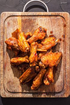 chicken wings on a cutting board ready to be cooked