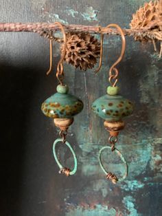 This is a pair of earthy rustic chic earrings I made featuring artisan lampwork glass beads and copper patina hoops. This pair also includes various rustic glass beads in shades of teal with hints of sea green and amber. They measure 2 1/2 inches long from the top of the copper handmade ear wires to the bottom of the patina hoops. Cold Connections, Teal Jewelry, Earthy Earrings, Earring Inspiration, Diy Jewelry Earrings, Earthy Jewelry, Earrings Ideas, Beaded Jewelry Necklaces, Jewelry Design Inspiration