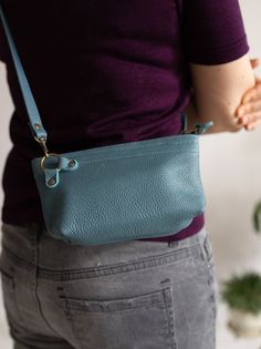 "A small and practical, minimal crossbody bag. Pure and minimalist, made of high quality blue leather, soft and solid. Holds whatever you may need it to hold, phone, coin purse, card holder, usb, a few keys, etc. Old gold zip and hardware. No lining. Adjustable strap. Dimesions: height: 11 cm/ 4,3\" widht: 19,5 cm/ 7,8\" depth: 5 cm/ 2\" strap : up to 130 cm/ 51\" Possibly to make in other colours. Feel free to write to me. Standard delivery time: European union: 4 - 10 days Europe (not EU): 7 - Blue Smooth Grain Shoulder Bag For Everyday Use, Blue Smooth Grain Bag For Everyday Use, Blue Smooth Grain Bag, Small Black Bag, Crossbody Leather Bag, Leather Crossbody Purse, European Union, Small Crossbody Bag, Small Crossbody