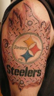 a man with a tattoo on his arm that says steeles and has a pittsburgh football logo