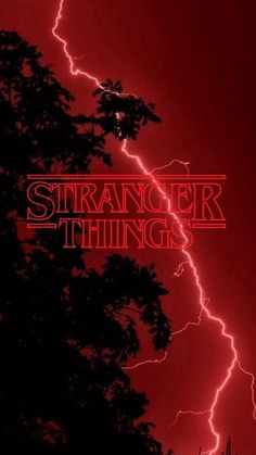 a red poster with the words, strange things on it and lightning in the background