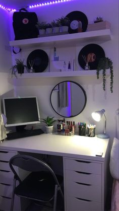 a white desk with a computer on top of it