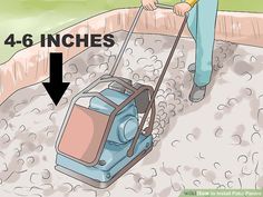 a person using a vacuum to clean the ground