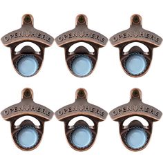 four metal bottle openers with blue glass in the center and one on each side