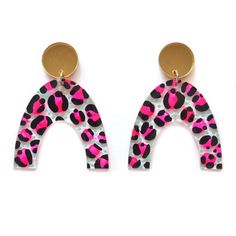 pink and black leopard print earrings with gold earring clippings on white background