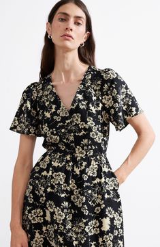 An enchanting floral pattern brightens up a flutter-sleeve midi dress in a classic A-line silhouette. 46 1/2" length (size 4) Front button closure V-neck Short sleeves Side-seam pockets Unlined 85% viscose, 15% polyamide Dry clean Imported Floral Print Midi Dress For Work, Patterned Short Sleeve Floral Midi Dress, Patterned Floral Print Short Sleeve Midi Dress, Printed Short Sleeve Midi Dress For Work, Summer Floral Dress For Work, Floral Print Dress For Summer Workwear, Summer Floral Dress For Workwear, Black Floral Print Short Sleeve Midi Dress, Black Floral Print Midi Dress With Short Sleeves