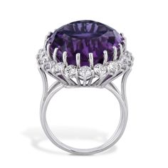 Gorgeous 14kt White Gold Oval Amethyst and Diamond Estate Ring from the H&H Estate Collection! Oval Amethyst measures 21.55mm x 16.35mm x 11.06mm and is set with 20 glimmering diamonds. An elegant size 5.5 ring befitting of any special occasion! Oval Amethyst and Diamond White Gold Estate Ring 14kt. White gold Oval Amethyst: Estimated 12.78ct TW Amethyst: 21.55mm x 16.35mm x 11.06mm Diamonds: 20pcs set around the center stone 1.70ct Diamond TW G/H SI Diamonds Size 5.5 H&H Estate Collection SKU:2 Estate Ring, Estate Rings, Diamond Sizes, Selling Jewelry, Diamond White, Sale Items, Vintage Jewelry, Special Occasion, Amethyst