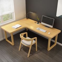 an office desk with a computer and chair