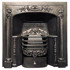 an antique fireplace with ornate carvings on the front and sides, in black marble finish