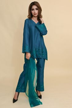 This elegant V-neck embroidered co-ord Set comes handcrafted in a loose-fitting cotton silk fabric laden with embroidery on ghera and sleeves along with embroidered palazzos. Organza stole adds to it elegance. Cotton Silk Fabric, Coord Set, Co Ord Set, Co Ord, Pakistani Fashion, Cotton Silk, Blue Fabric, Teal Blue, Fabric Cotton