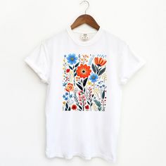 Looking for a cute versatile top to wear this summer? Make sure to grab one of our Cottagecore Floral garment dyed graphic tees! This soft and comfortable graphic tee is the perfect top for any outfit. It can be paired with biker shorts, jeans, or even a simple skirt/dress! This tee is true-to-size, so be sure to order your regular t-shirt size! If you are looking for a more oversized look, make sure to size up! Simple Skirt, T Shirt Flowers, Floral Fit, Floral Short, Shorts Jeans, Cute Tshirts, Skirt Dress, Sheer Fabrics, Biker Shorts