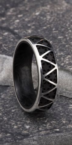 Designed by Derek Lloyd and inspired by architectural forms, each Truss ring is handcrafted entirely in New York City. The ring's exterior is made of silver and blackened silver and paired with an interior of Forged Carbon Fiber. Luxury Hand Forged Promise Ring, Ring Carbon, Cage Ring, Lattice Structure, Traditional Wedding Bands, Forged Carbon Fiber, Architectural Forms, Fathers Day Sale, Wide Bands