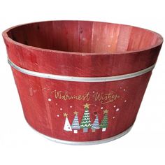 a red wooden bucket with christmas trees painted on the side and writing'warmest wishes '