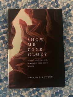 the book show me your glory by steve s lawon sits on a floral background