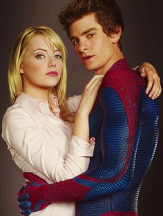 the amazing spider - man and woman are posing together