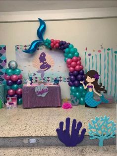 a mermaid themed birthday party with balloons and decorations