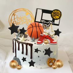 a birthday cake decorated with basketballs and stars