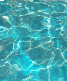 the water is very clear and blue with ripples in it's bottom half