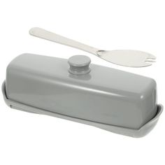 a gray container with a spoon on top of it