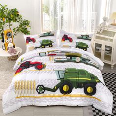 a bed with a green tractor on it