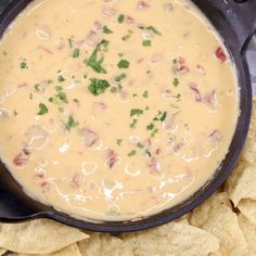 a skillet filled with cheese and tortilla chips