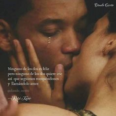 a man and woman kissing each other in front of a quote