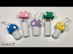 crochet toothbrush holders with mushrooms on them are lined up next to each other