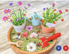 an arrangement of flowers and gardening tools in a pot