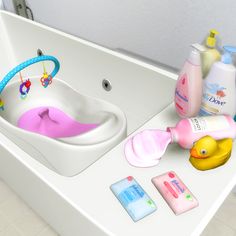 a bathroom sink filled with lots of toys