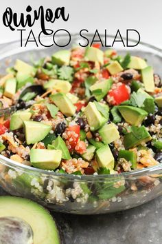 quiche taco salad in a glass bowl with avocado on the side