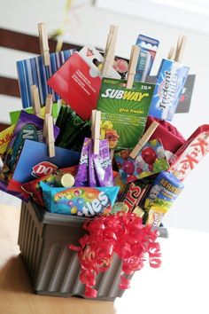 a basket filled with candy and candies on top of a table