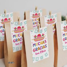 there are many small bags that have some tacos on them and the words munchies gracias