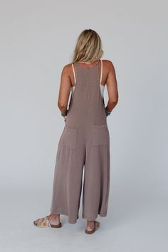 Excited to bring you the Urban Light Textured Jumpsuit from our exclusive collection; The Nest by Three Bird Nest. Check out the rest of the collection here - Inspired by you, created by us. So soft and comfortable textured ribbed fabric Relaxed and loose overall jumpsuit silhouette Classic square neckline with adjustable self-tie straps Flattering pointed pleated center seam Convenient side seam and back patch pockets Loose wide pant legs Pair with: Audra Waistband Loop Lace Bralette, Dream Vac Solid Cotton Overalls For Loungewear, Cotton Overalls For Loungewear, Cotton Lounging Jumpsuits And Rompers In Solid Color, Brown Cotton Jumpsuits And Rompers For Loungewear, Casual Solid Ribbed Jumpsuits And Rompers, Casual Ribbed Jumpsuits And Rompers For Lounging, Textured Jumpsuit, Urban Light, Boho Essentials