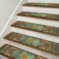 a set of stairs with rugs on them