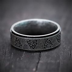 The Valknut is a symbol that is commonly associated with Norse mythology, but has its origins in the Viking era. It represents a warrior slain in battle. This ring will fit most fingers. The viking ring is intricately designed from stainless steel and detailed by a skilled craftsman to make it look authentic like a true viking ring. - 3 Colors availableOur shop offers a variety of highly stylized stainless steel rings with the Valknut symbol. This is the Viking ring you have been looking for to Viking Style Adjustable Engraved Rings, Viking Style Engraved Adjustable Rings, Adjustable Engraved Viking Rings, Valknut Symbol, Nordic Symbols, World Serpent, Nordic Runes, Mjolnir Pendant, Viking Ring