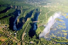 an aerial view of a river and mountains