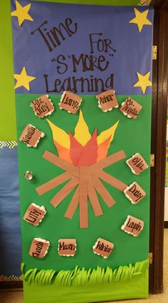 a classroom door decorated with paper cutouts and the words time for s'more learning