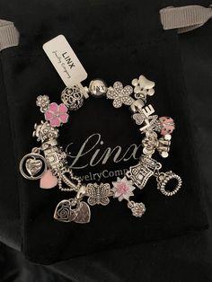 Linx snake chain style charm bracelet in 925 sterling silver, with a ball clasp.  Bracelet is available in multiple sizes, including child size. This bracelet comes with 17 UNBRANDED charms in sterling, silver with other alloy metals. Unbranded charms are a more affordable option and are recommended for customers who like to change their charms out often, to match different holidays, themes, outfits, etc..., without spending a fortune. If you prefer lower maintenance charms that you intend to we Pink Charm Bracelet With Silver Beads For Gift, Pink Charm Bracelet With Silver Beads As A Gift, Silver Charm Bracelet With Lobster Clasp And Round Beads, Pink Charm Bracelet With Silver Beads, Ideal For Gifting, Silver Snake Chain Bracelet With Charms, Silver Charm Bracelet With Round Beads, Pandora Bracelet Charms Ideas, Snake Chain Bracelets, Jewelry Accessories Ideas