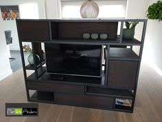 an entertainment center with a flat screen tv