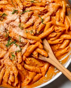 pasta with sauce and parmesan cheese in a pan