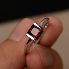 This is a gorgeous handmade creation. Its beauty is its simplicity & Elegance. The 6*6 mm Princess cut garnet (about 1.51 ct) is crafted in solid sterling silver or 14k white/rose/yellow gold All item is sent in a beautiful gift box If you have any idea of design your ring,pls contact me directly. You can realize more lovely stuff clicking the link https://www.etsy.com/shop/knightjewelry?refshopsection_shophome_leftnav Please leave the correct address and you phone number for delivering succ Jewelry Princess, Rings White Gold, Rings Red, Cut Rings, Red Gemstone Ring, Jewelry Knowledge, January Birthstone Jewelry, Red Garnet Ring, Rings Etsy