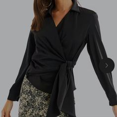 Black Wrap Front Ties On Side, V-Neck Long Sleeve Blouse. Zips Up On Left Side. Bust 32" Length 21" Versatile V-neck Blouse For Night Out, Elegant Wrap Blouse For Work, Sleek Tops For Office Wear In Fall, Sleek Fall Tops For Office Wear, Chic Wrap Blouse For Work, Trendy V-neck Blouse For Office Wear, Trendy V-neck Top For Office Wear, Versatile Black Blouse For Office, Spring V-neck Office Wear Tops