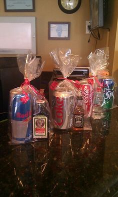 some soda bottles wrapped in plastic bags on a table